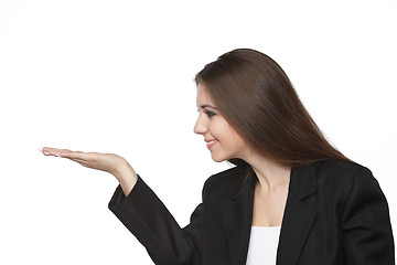 Image showing Business woman looking at her empty hand