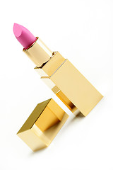 Image showing Pink golden lipstick on white background