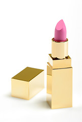 Image showing Pink golden lipstick on white background