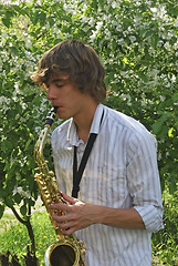 Image showing young man with saxophone