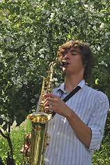 Image showing young man with saxophone