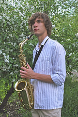 Image showing young man with saxophone