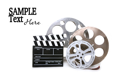 Image showing Canisters of Film With Directors Clapboard on White Background