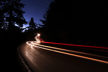 Image showing Car Light Trails in the Mountains on a Starry Night
