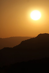 Image showing Vertical Silhouette Sunrise of Hazy Misty Mountains