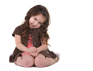 Image showing Brown Haired Young Child Tilting Her Head Sideways