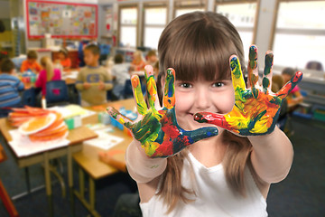 Image showing School Age Child Painting With Her Hands in Class