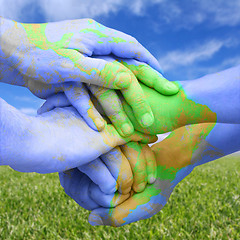 Image showing Hands Painted Like a Map Representing Global Responsibility