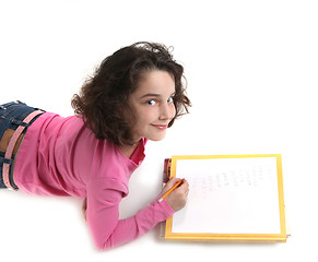 Image showing Young Child Writing Her Homework on Paper