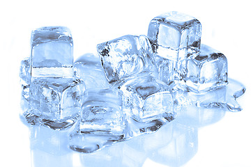 Image showing Cool Ice Cubes Melting on a  White Reflective Surface