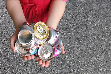 Image showing Child Recycling Aluminum Cans