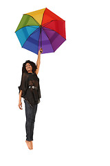 Image showing Woman Falling Down Holding Rainbow Colored Umbrella