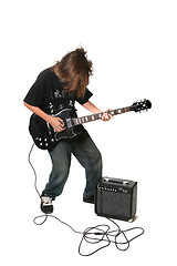 Image showing Teenager Playing Electric Guitar With Amplifier