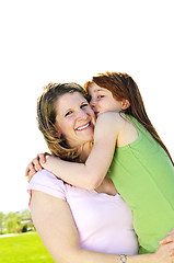 Image showing Mother and daughter hugging
