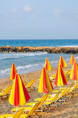 Image showing sunbeds and umbrellas