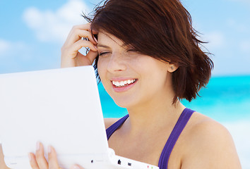 Image showing woman with laptop computer on the beach