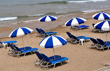 Image showing sunbeds and umbrellas
