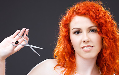 Image showing redhead with scissors