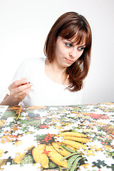 Image showing woman doing  puzzle