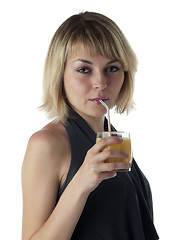 Image showing blonde drinking juice