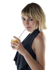 Image showing Blonde drinking juice