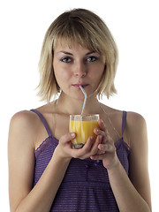 Image showing Blonde drinking juice