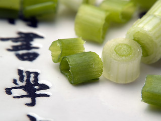 Image showing Cut green onion on plate