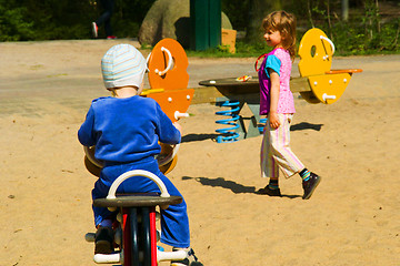 Image showing The girl and the boy on sand