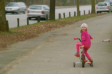 Image showing The girl on a bicycle
