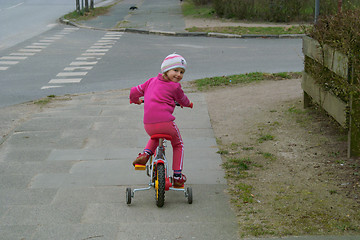 Image showing The girl on a bicycle