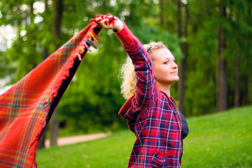 Image showing woman with red coverlet