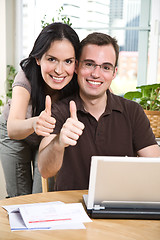 Image showing Happy couple giving thumbs up 