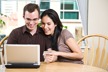 Image showing Happy couple shopping online