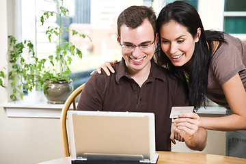 Image showing Happy couple shopping online