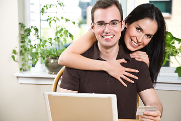 Image showing Happy couple shopping online