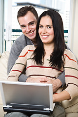 Image showing Happy couple browsing internet at home