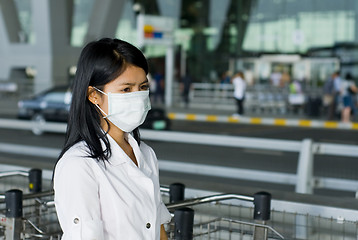 Image showing protective face mask on asian woman