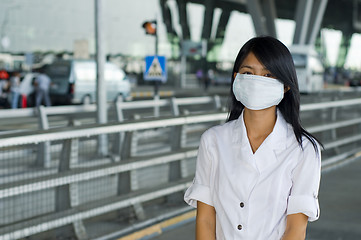 Image showing protective face mask on asian woman