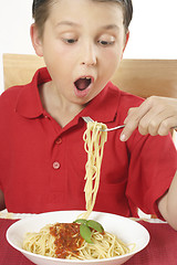 Image showing Child eating spaghetti