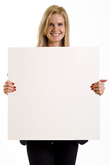 Image showing attractive businesswoman holding a blank board