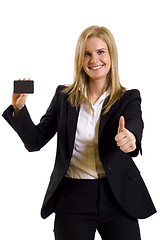 Image showing attractive businesswoman holding a blank card