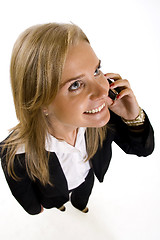 Image showing   wide angle picture of an attractive businesswoman on the phone