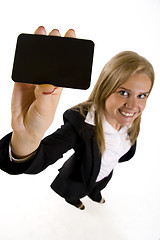 Image showing wide angle picture of an attractive businesswoman presenting a blank card