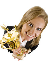 Image showing wide angle picture of an attractive businesswoman winning a gold cup