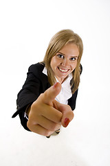 Image showing wide angle picture of an attractive businesswoman pointing at you