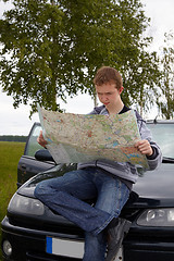 Image showing Young driver with maps