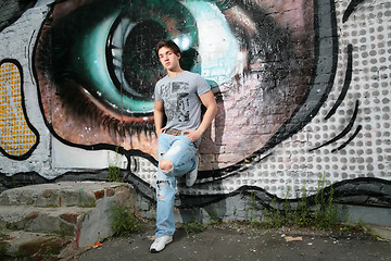 Image showing lad near wall with graffiti