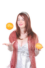 Image showing girl and flying orange