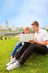 Image showing pretty blond, yong man and laptop