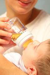 Image showing child eats from bottle